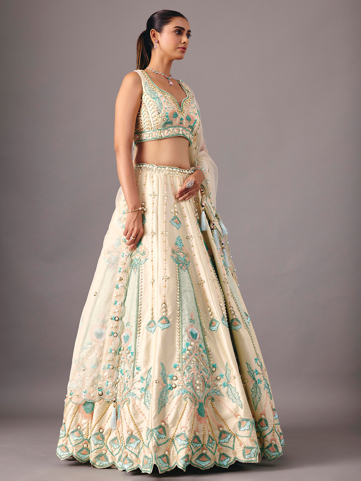 Cream silk lehenga choli with pearl and thread detailing