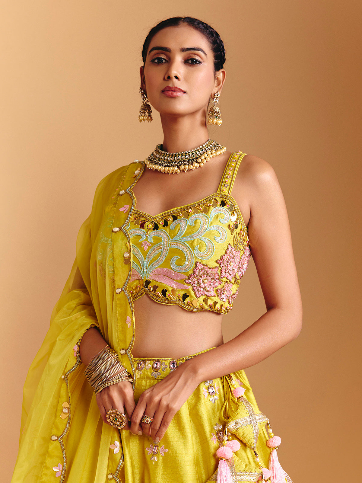 Yellow raw silk lehenga choli with mirror embellishments