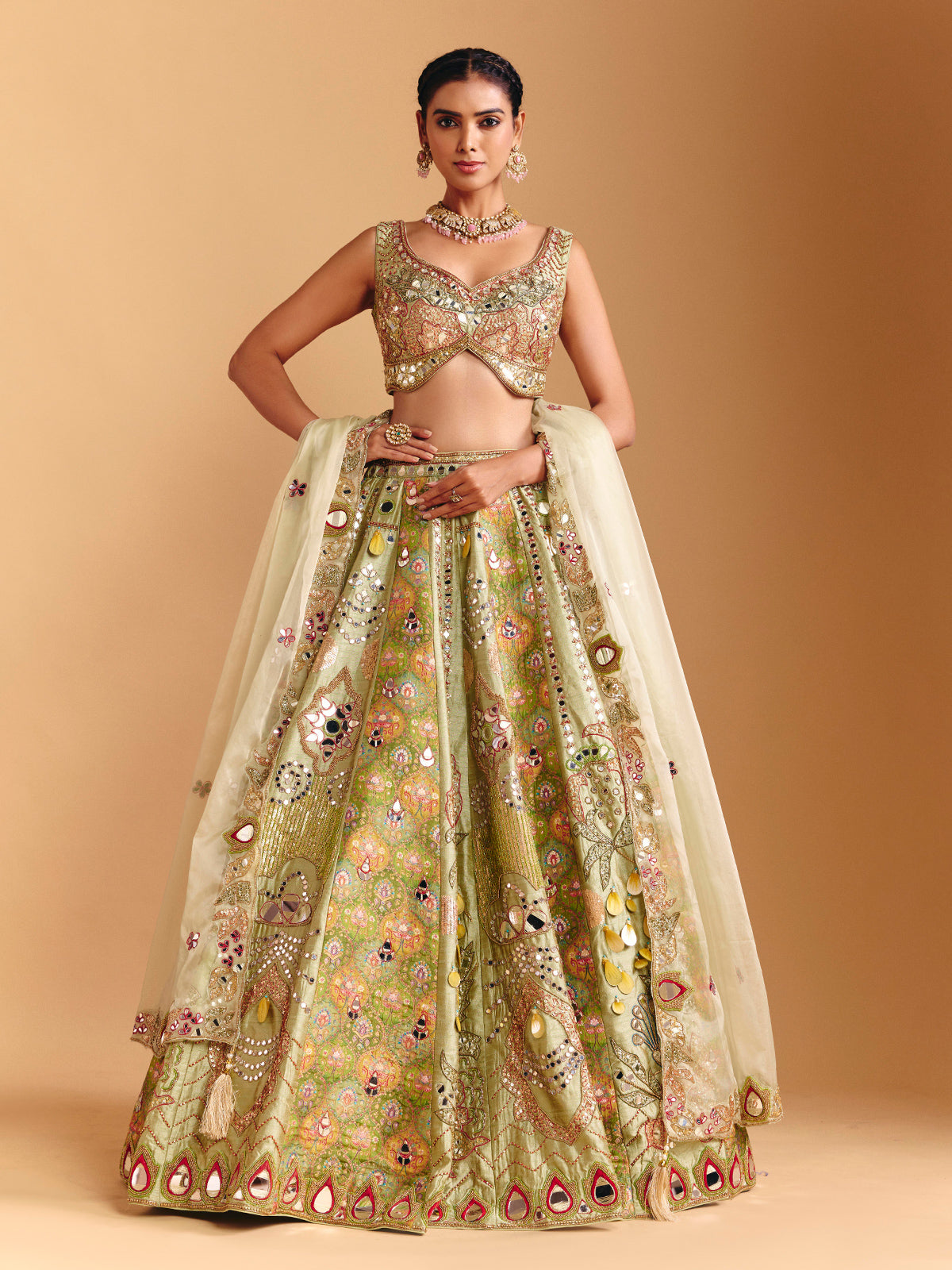 Pista green raw silk lehenga choli with printed artistry