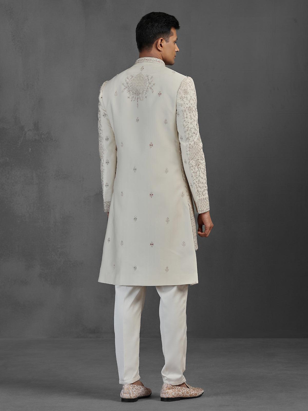 Beige silk groom sherwani with intricate embroidery