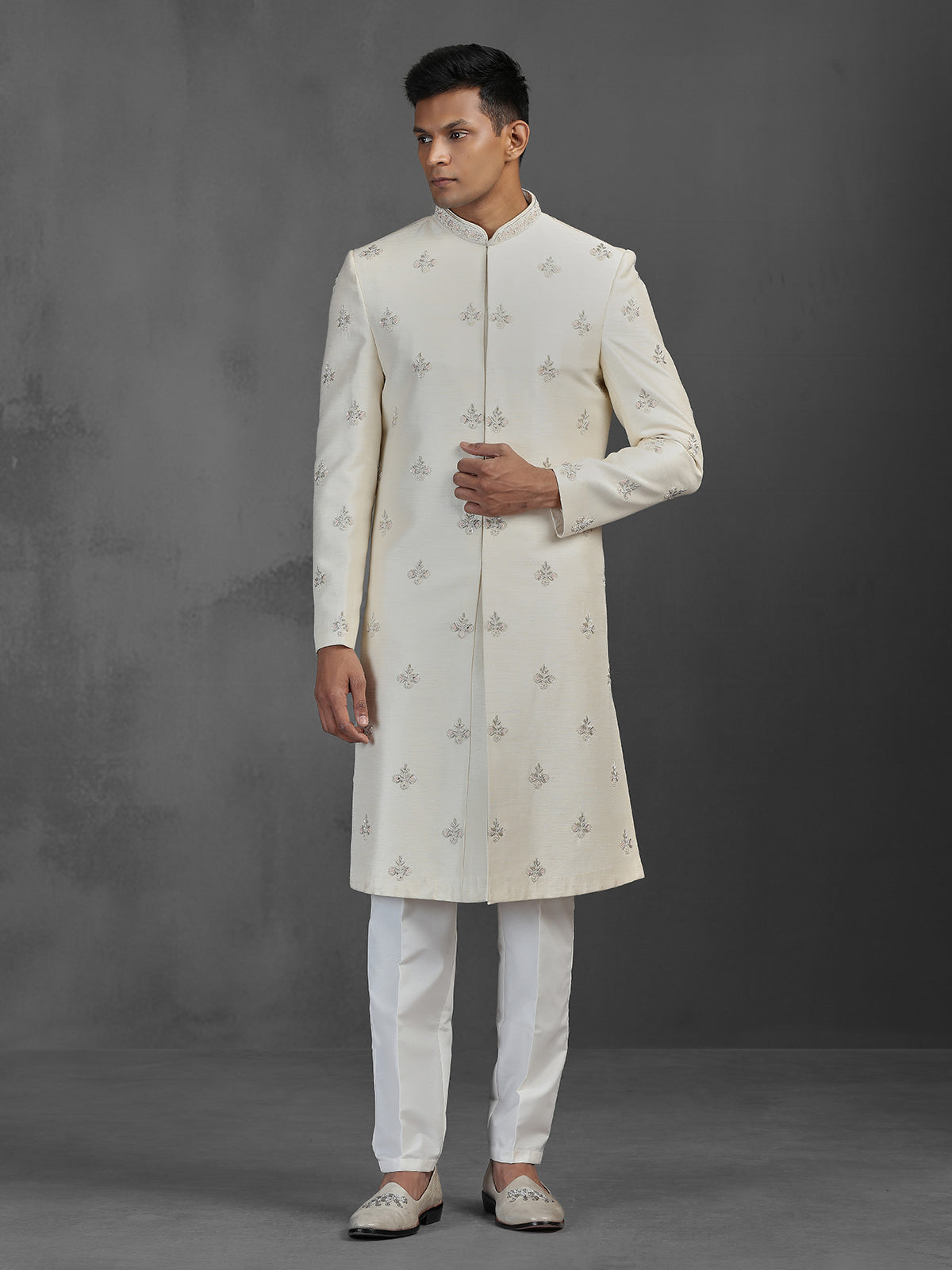 Cream silk wedding sherwani with butti work