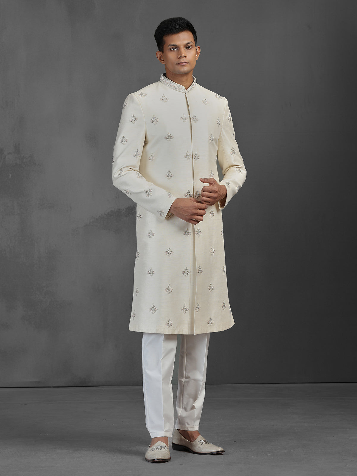 Cream silk wedding sherwani with butti work