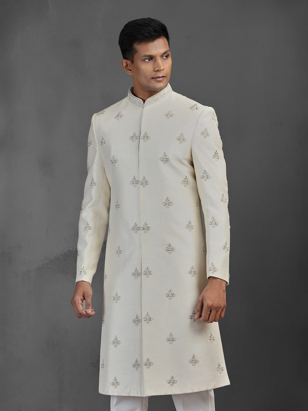 Cream silk wedding sherwani with butti work