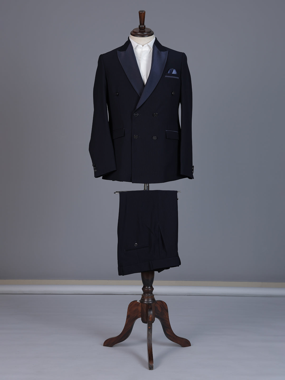 Navy blue designer double breasted suit with satin peak lapel finish