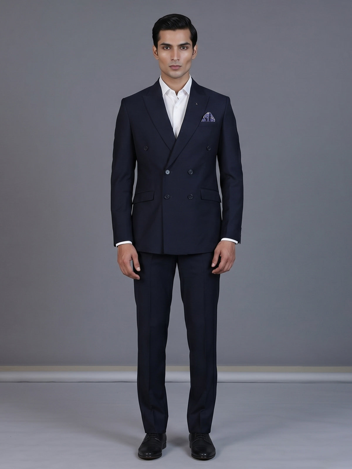 Elegant navy blue formal double breasted suit with peak lapel