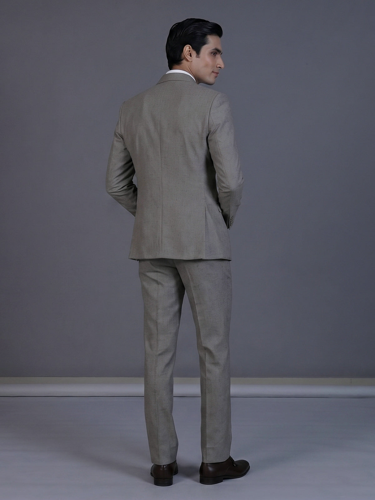 Taupe designer double breasted suit with textured birdseye peak lapel