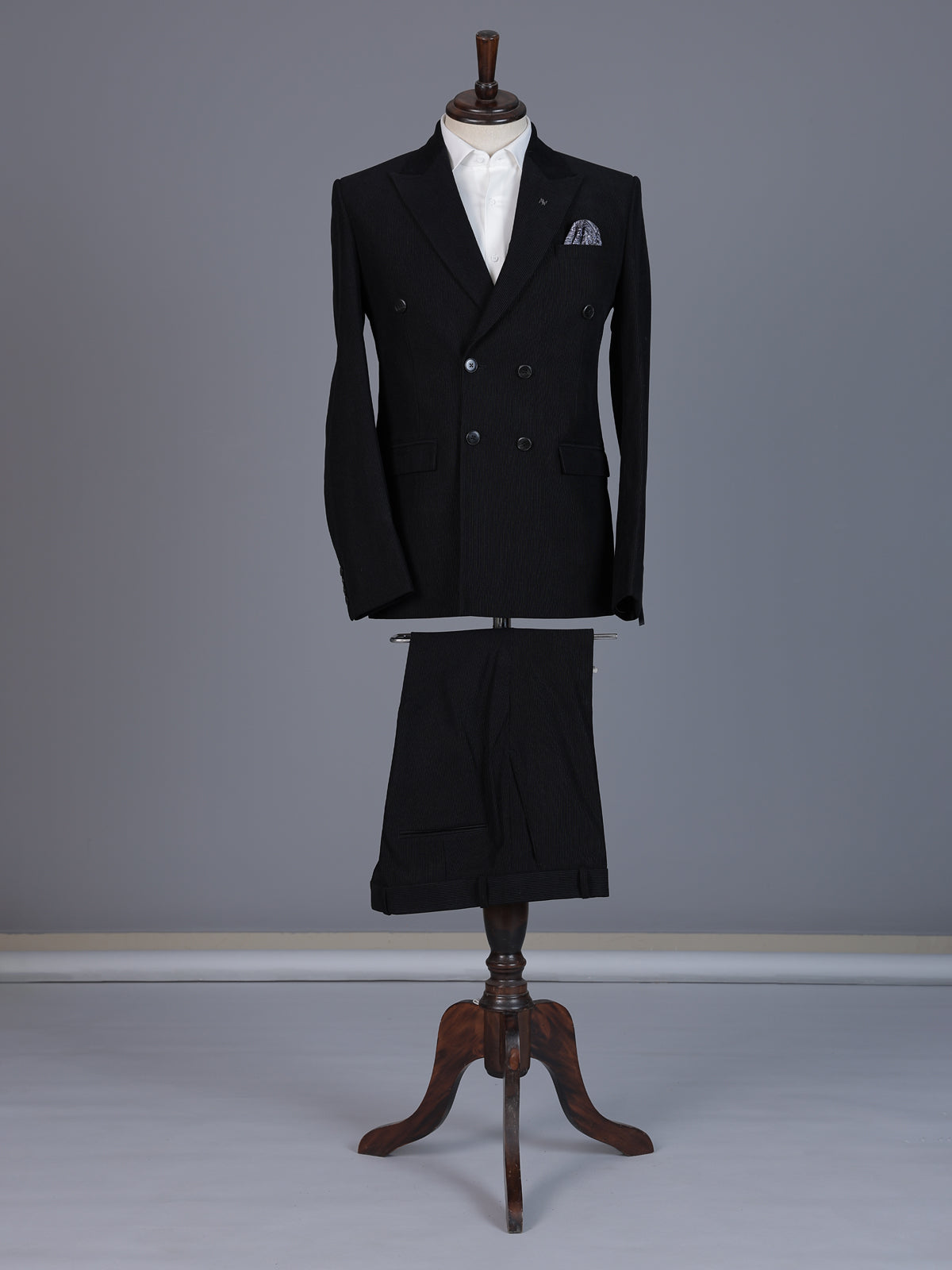 Black pinstripe formal double breasted suit with wide peak lapel