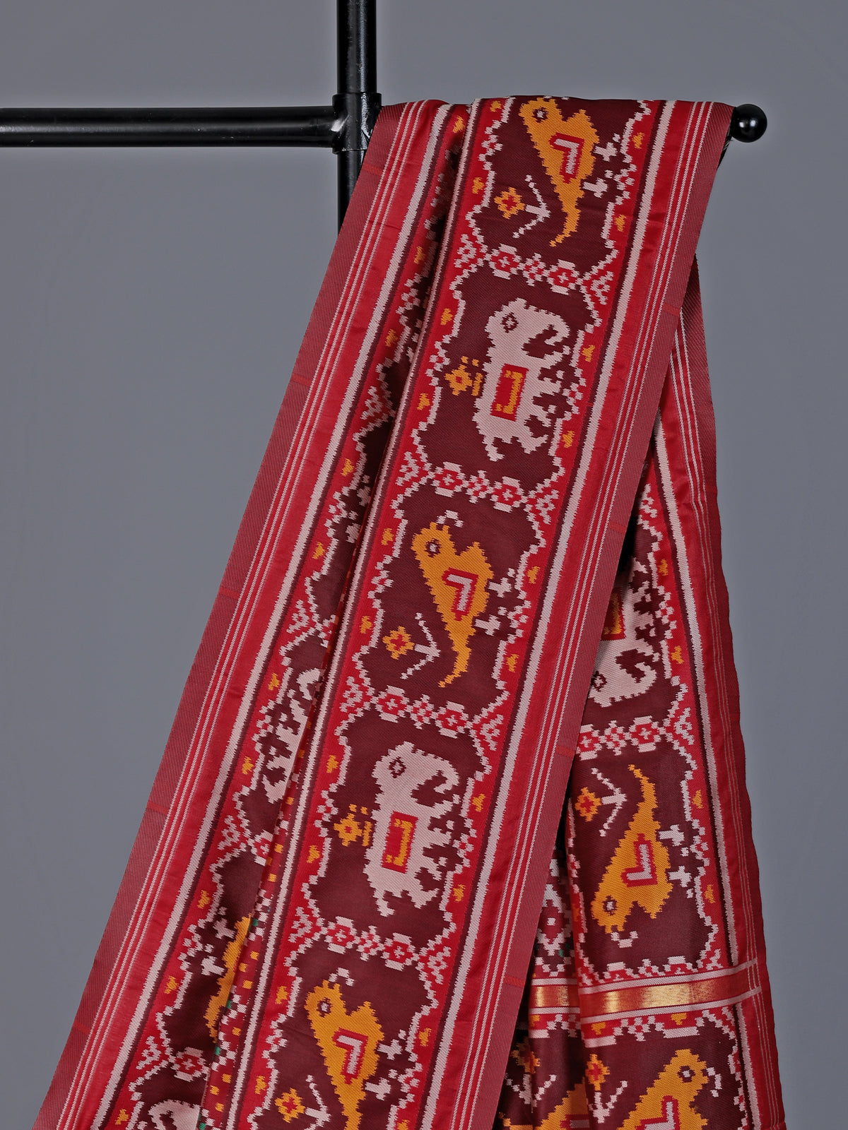Maroon patola silk saree with zari pallu design