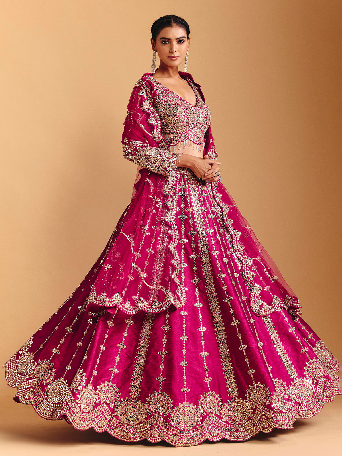 Deep rani pink raw silk lehenga choli with mirror embellishments