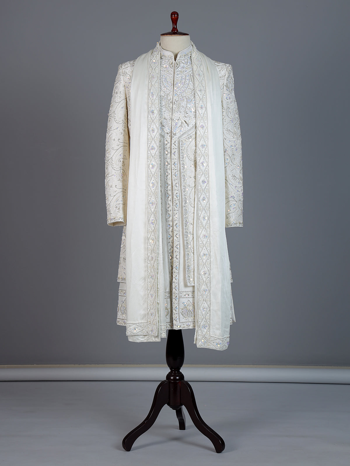 White raw silk sherwani with intricate embroidery and stone detailing