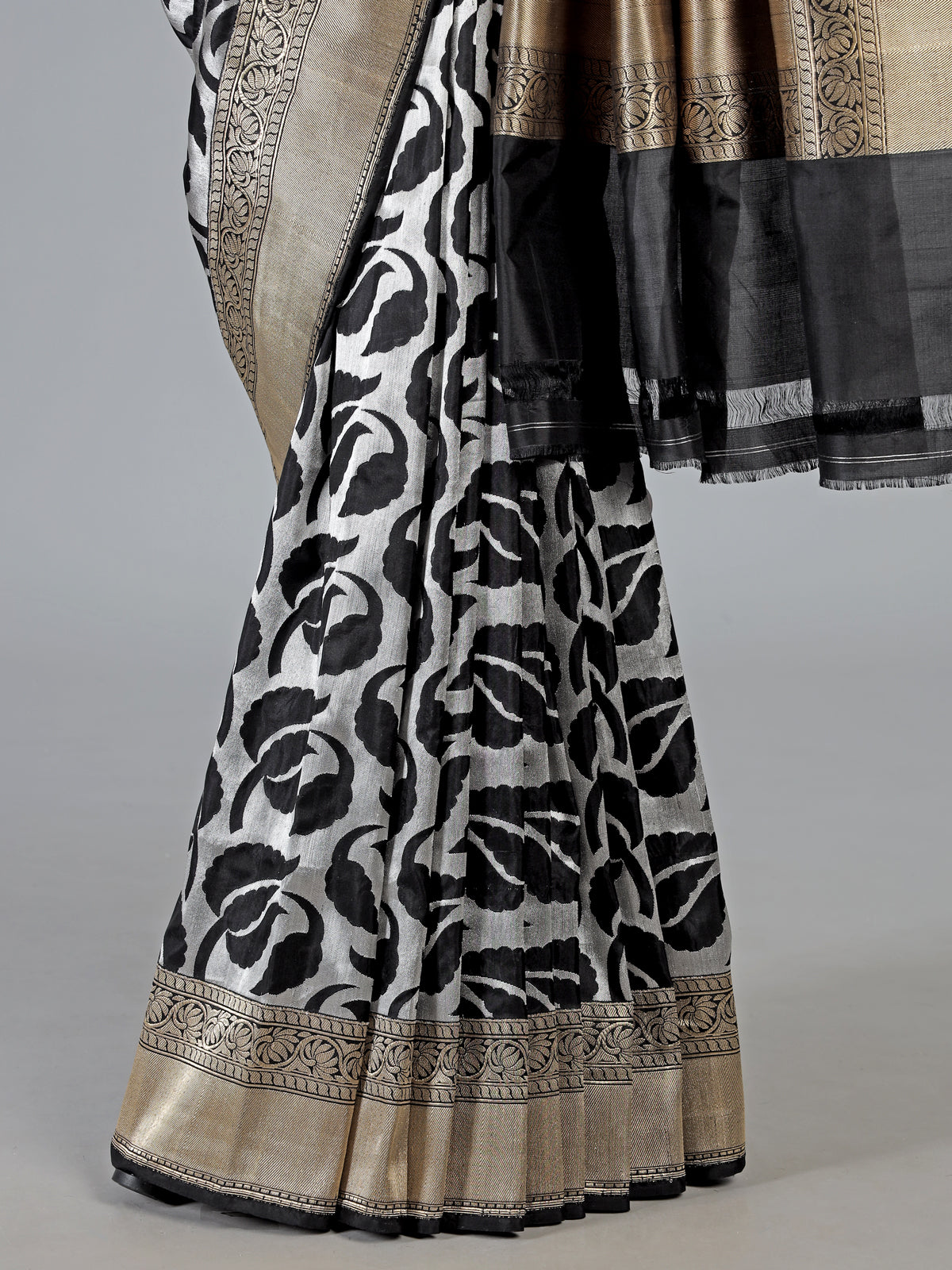 Black banarasi silk saree adorned with elegant silver zari detailing