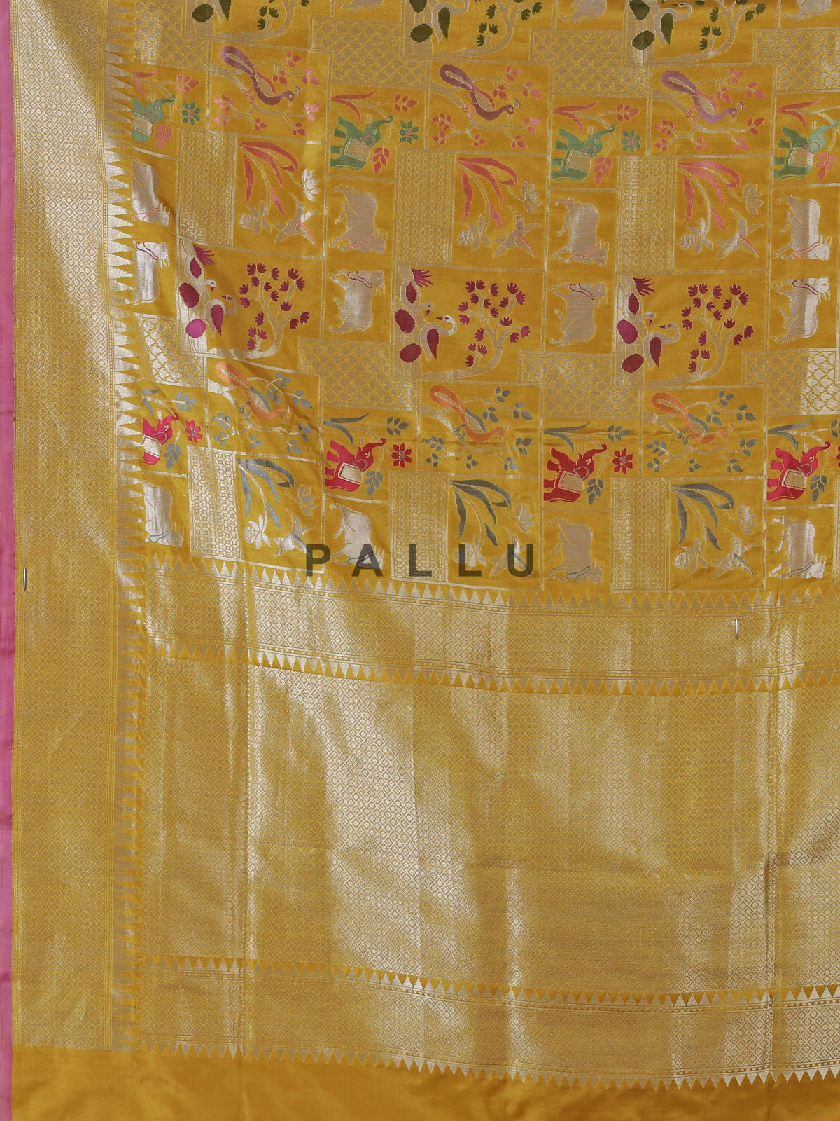 Yellow banarasi silk festive saree enhanced with shimmering zari accents