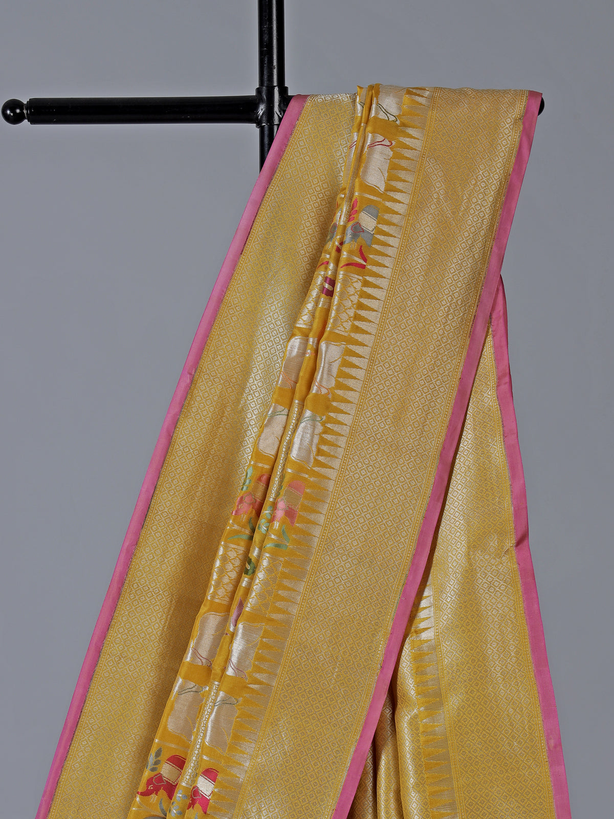Yellow banarasi silk festive saree enhanced with shimmering zari accents