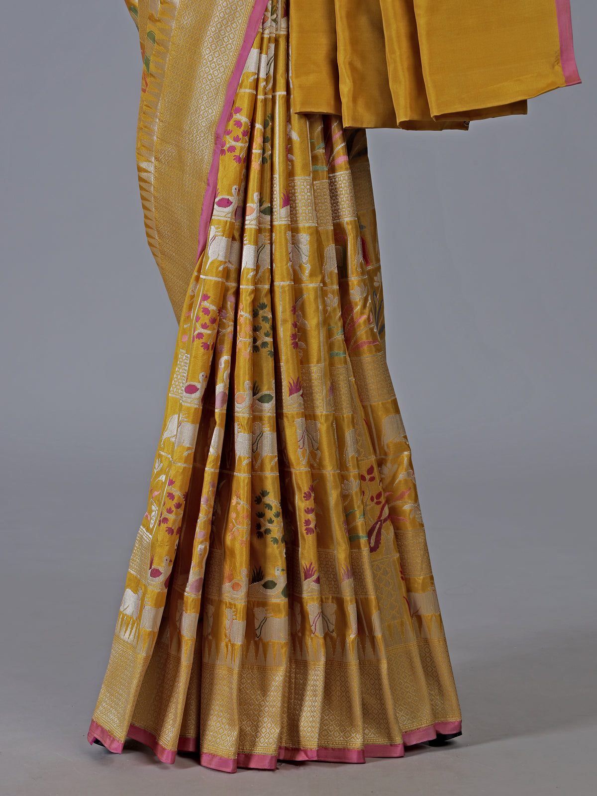 Yellow banarasi silk festive saree enhanced with shimmering zari accents