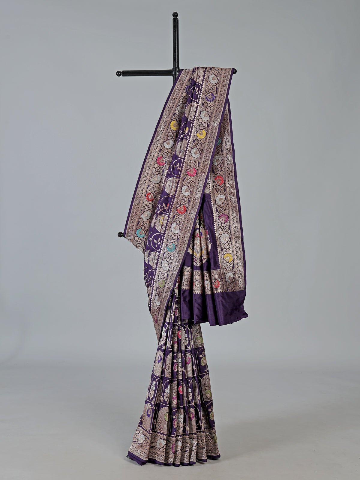 Purple banarasi silk saree featuring detailed zari work for weddings