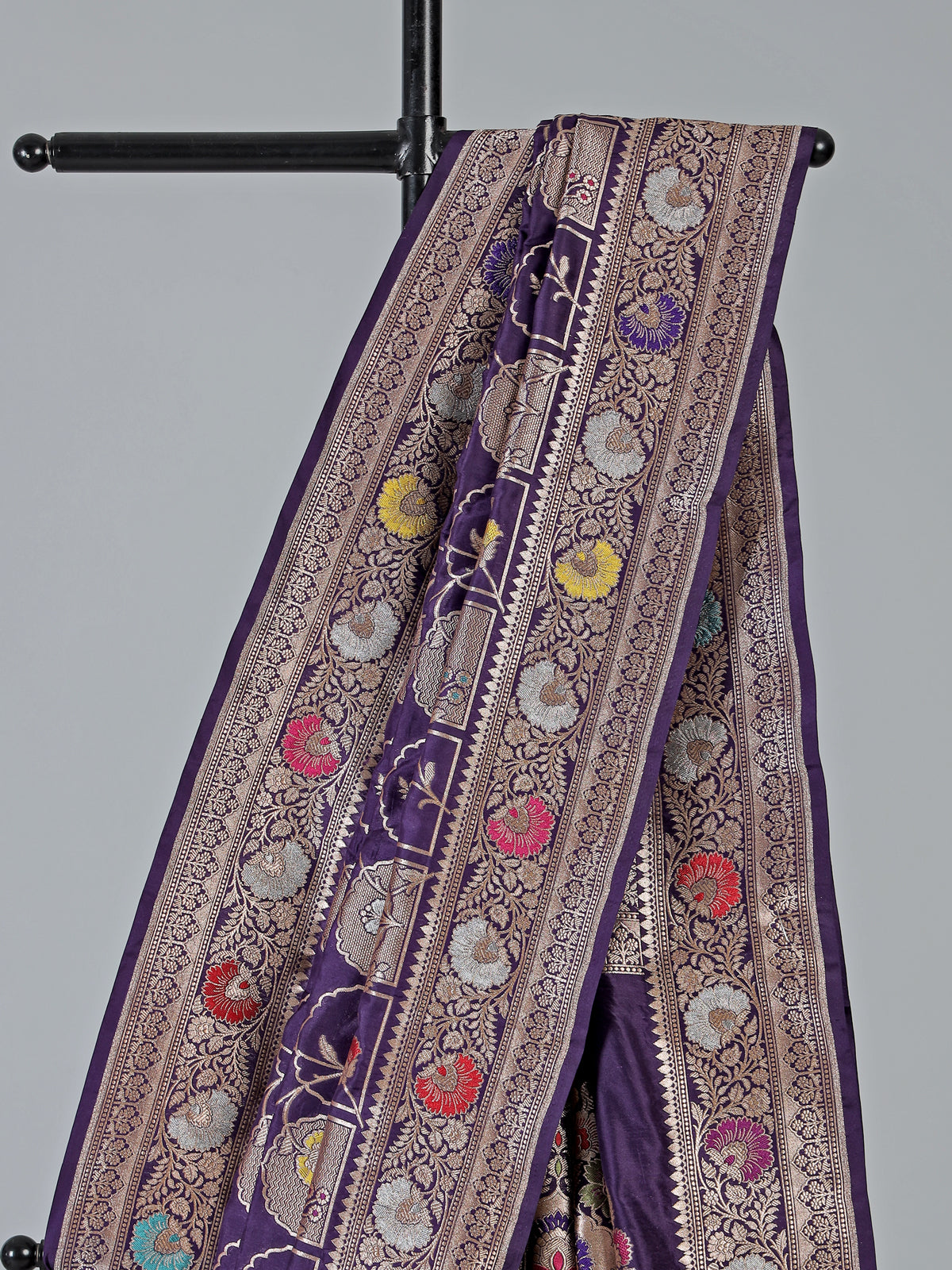 Purple banarasi silk saree featuring detailed zari work for weddings