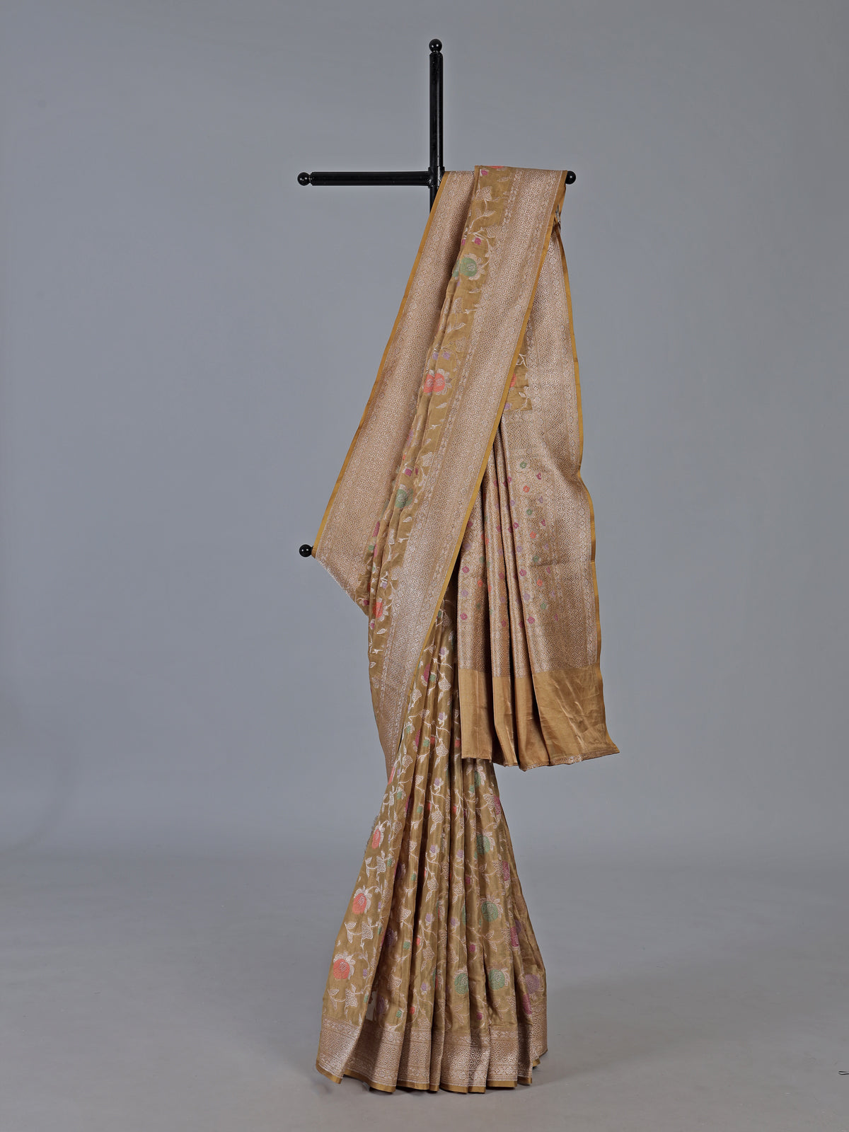 Beige banarasi silk saree highlighted with golden zari detailing