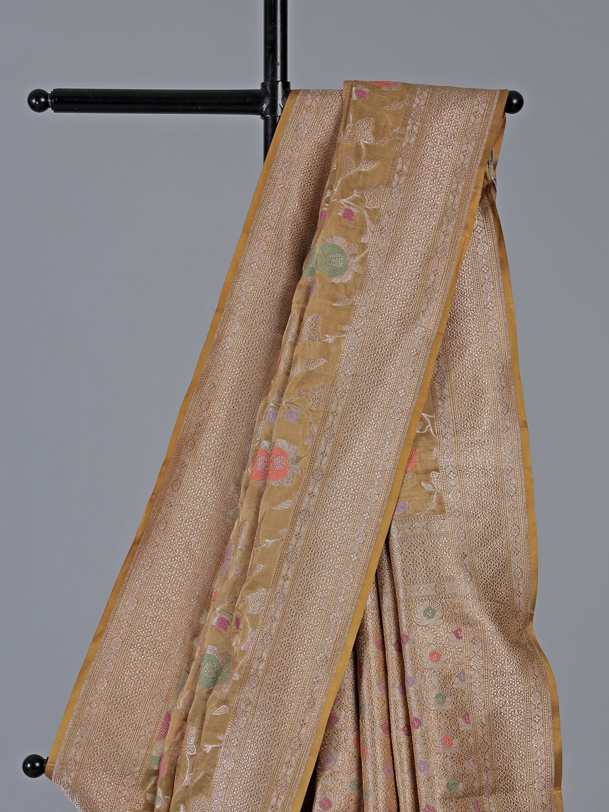Beige banarasi silk saree highlighted with golden zari detailing