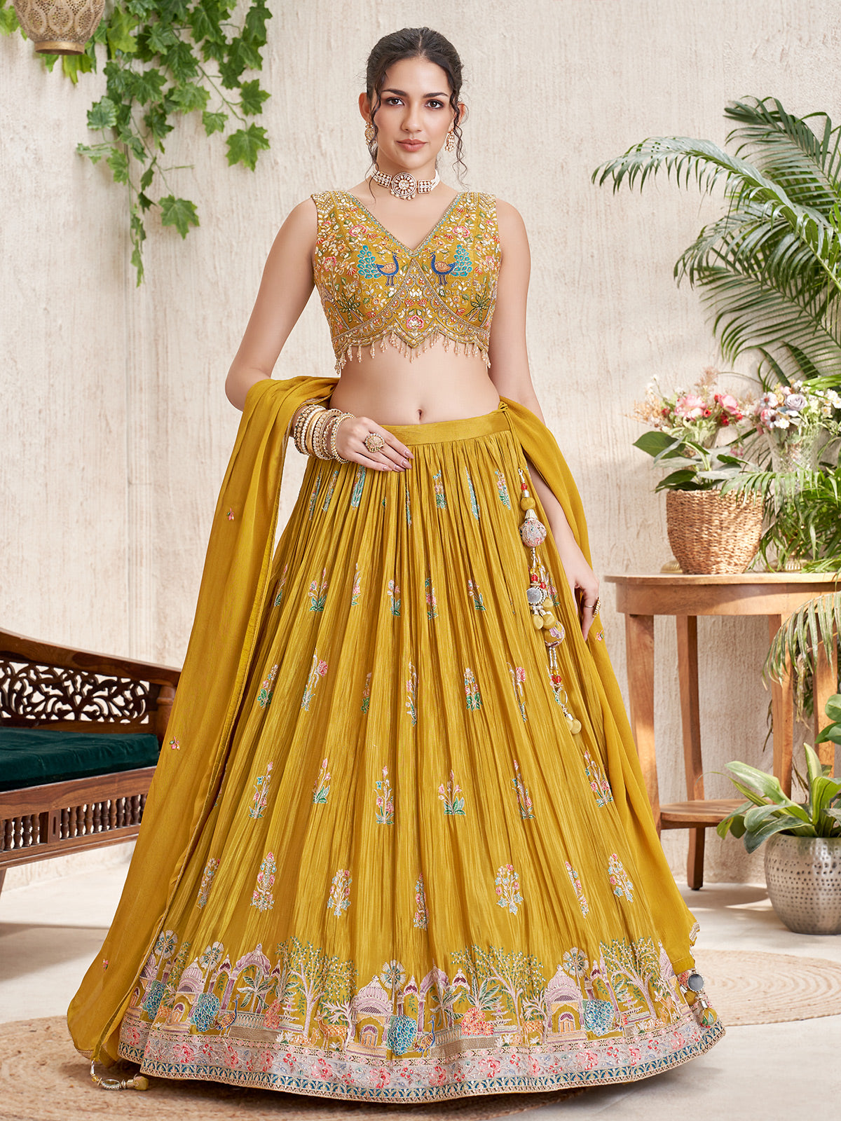 Mustard silk lehenga choli with peacock and deer motifs