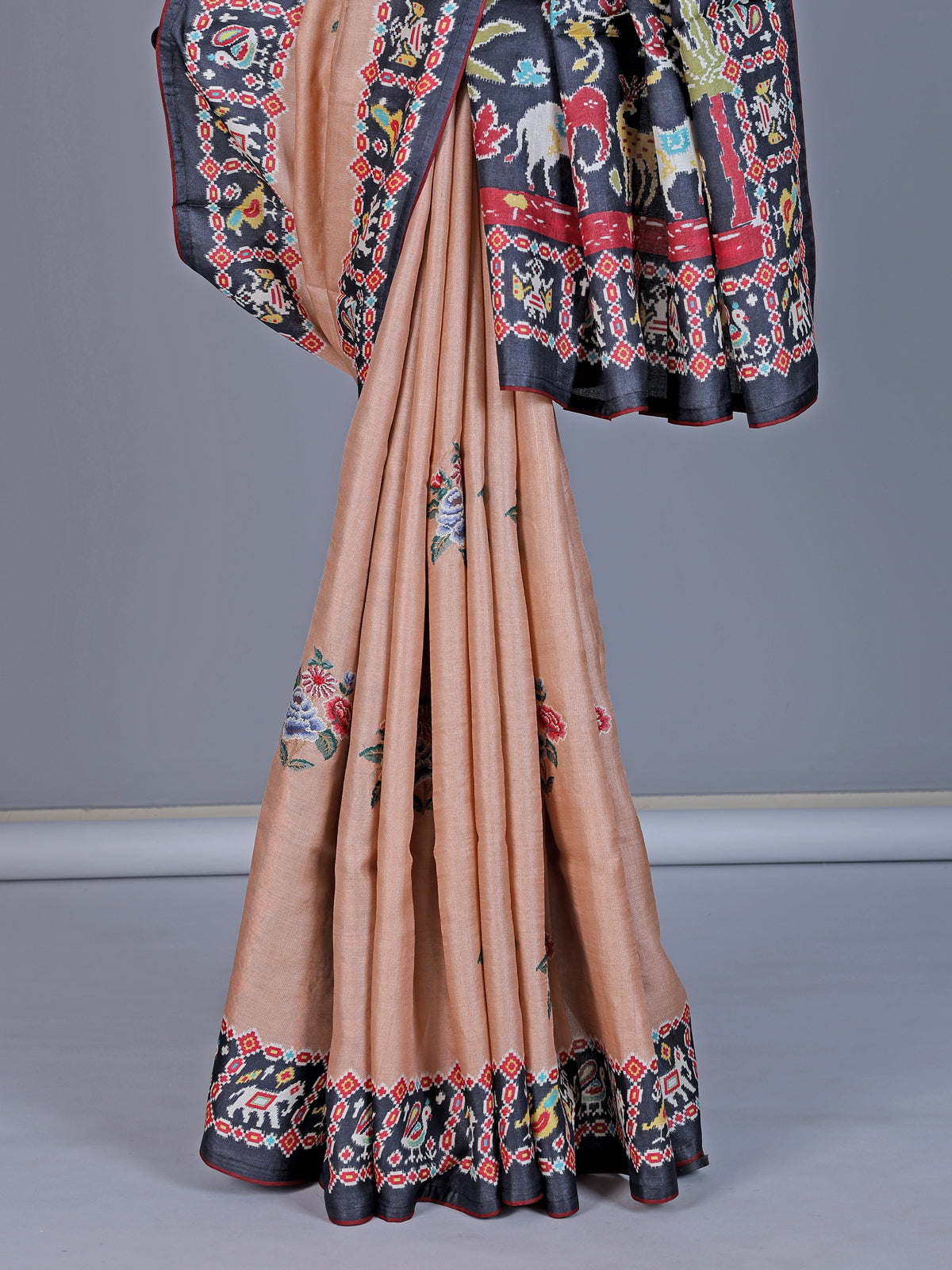 Soft peach art tusser silk saree with artistic prints and rich pallu