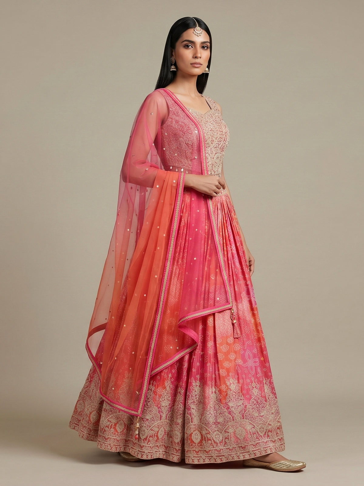 Pink silk bandhej lehenga choli with mirror and tassel work