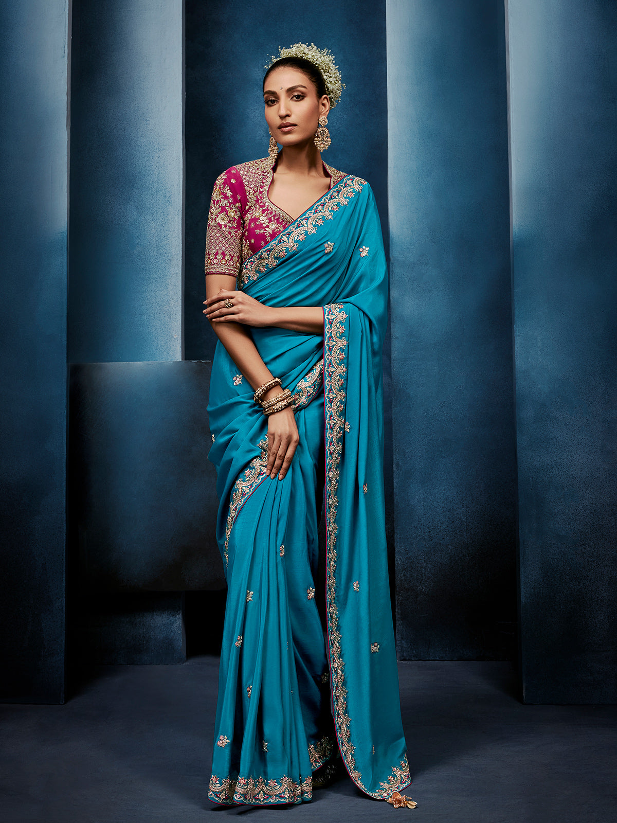 Blue silk saree paired with a striking red blouse