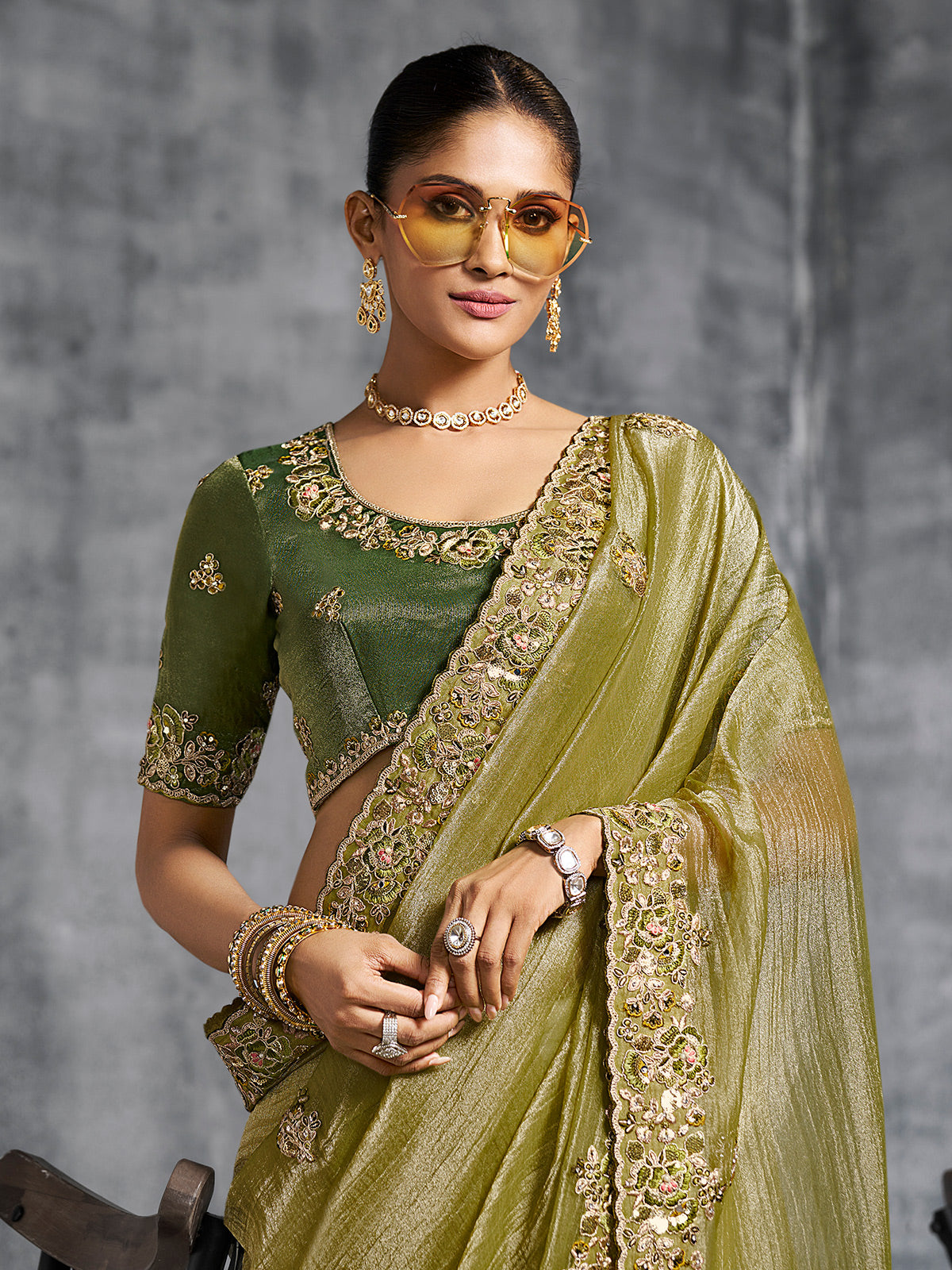 Olive green viscose tissue saree with embellished border