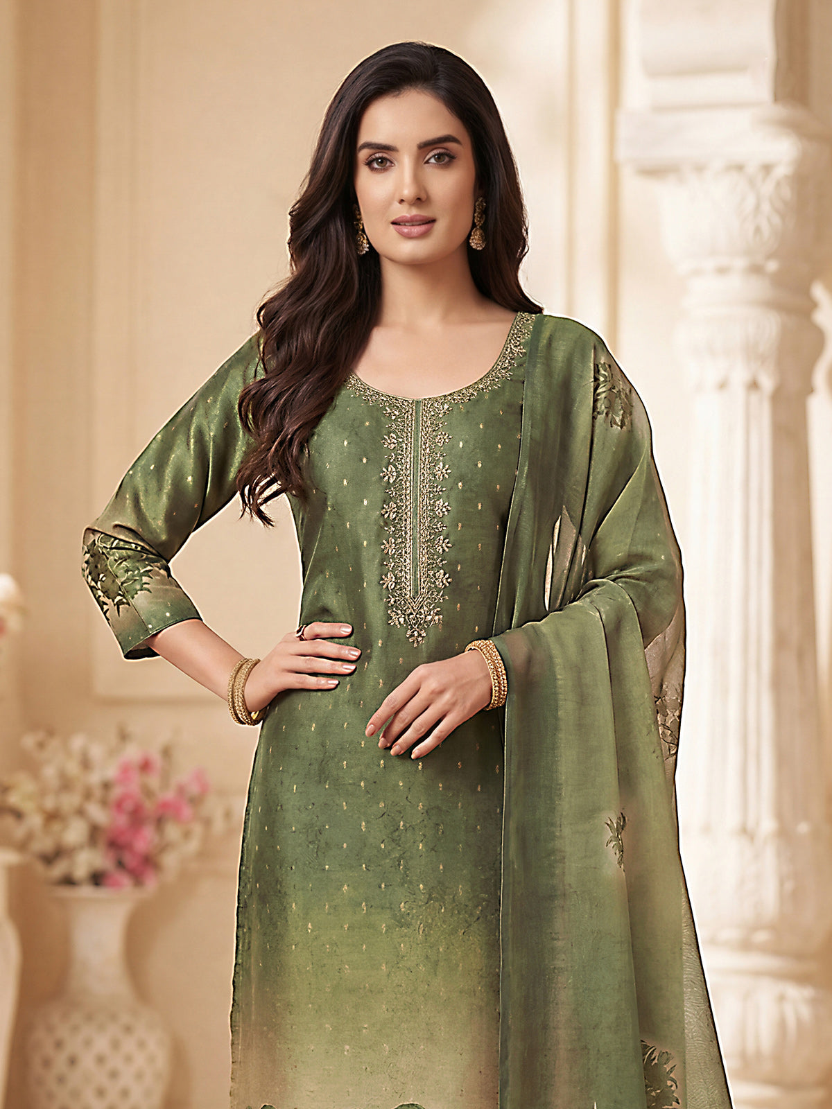 Green silk straight cut salwar suit with festive embellishments