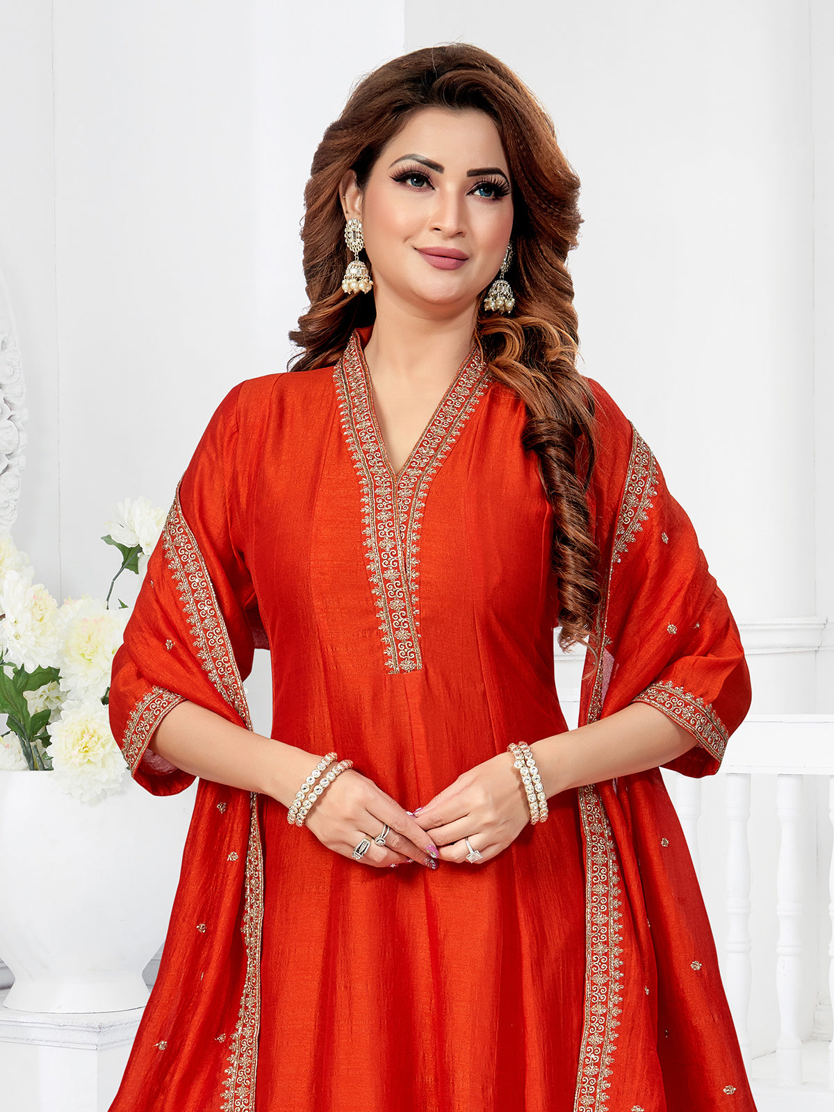 Rust orange silk anarkali suit with festive shimmer