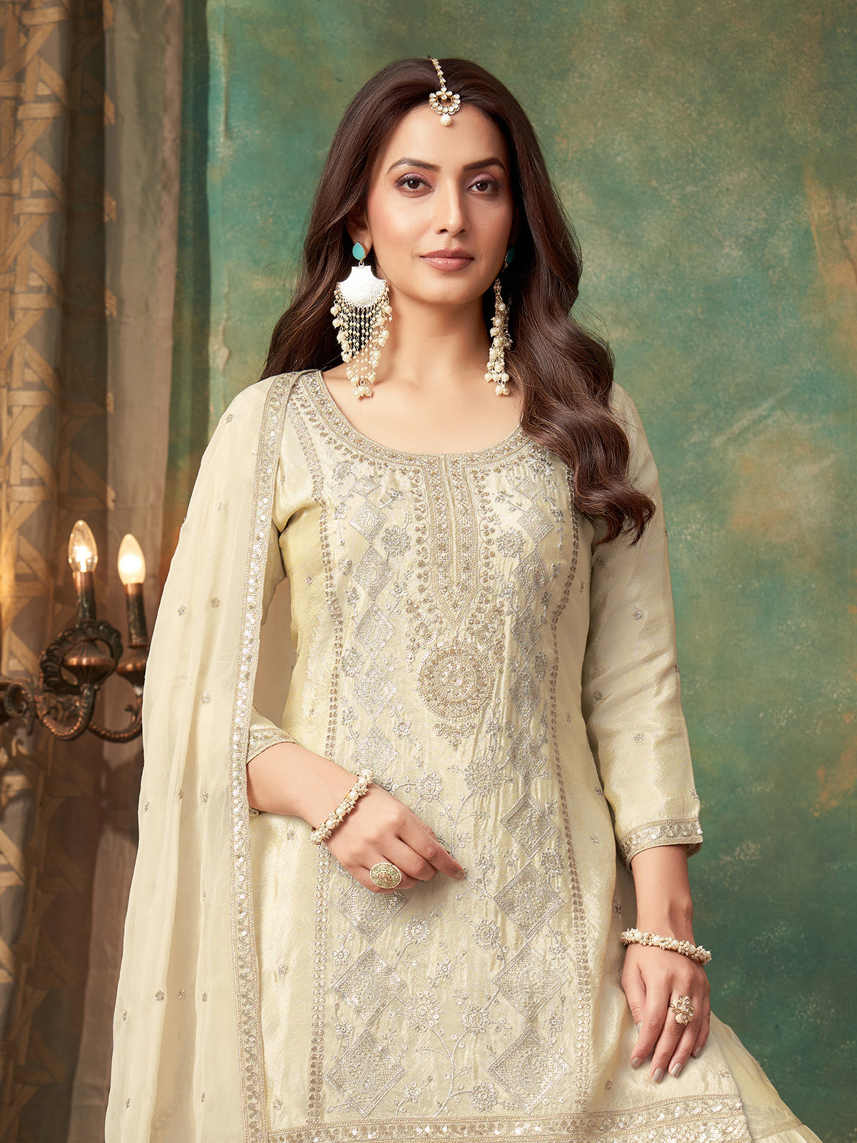 Cream tissue silk sharara suit with zari embellishments