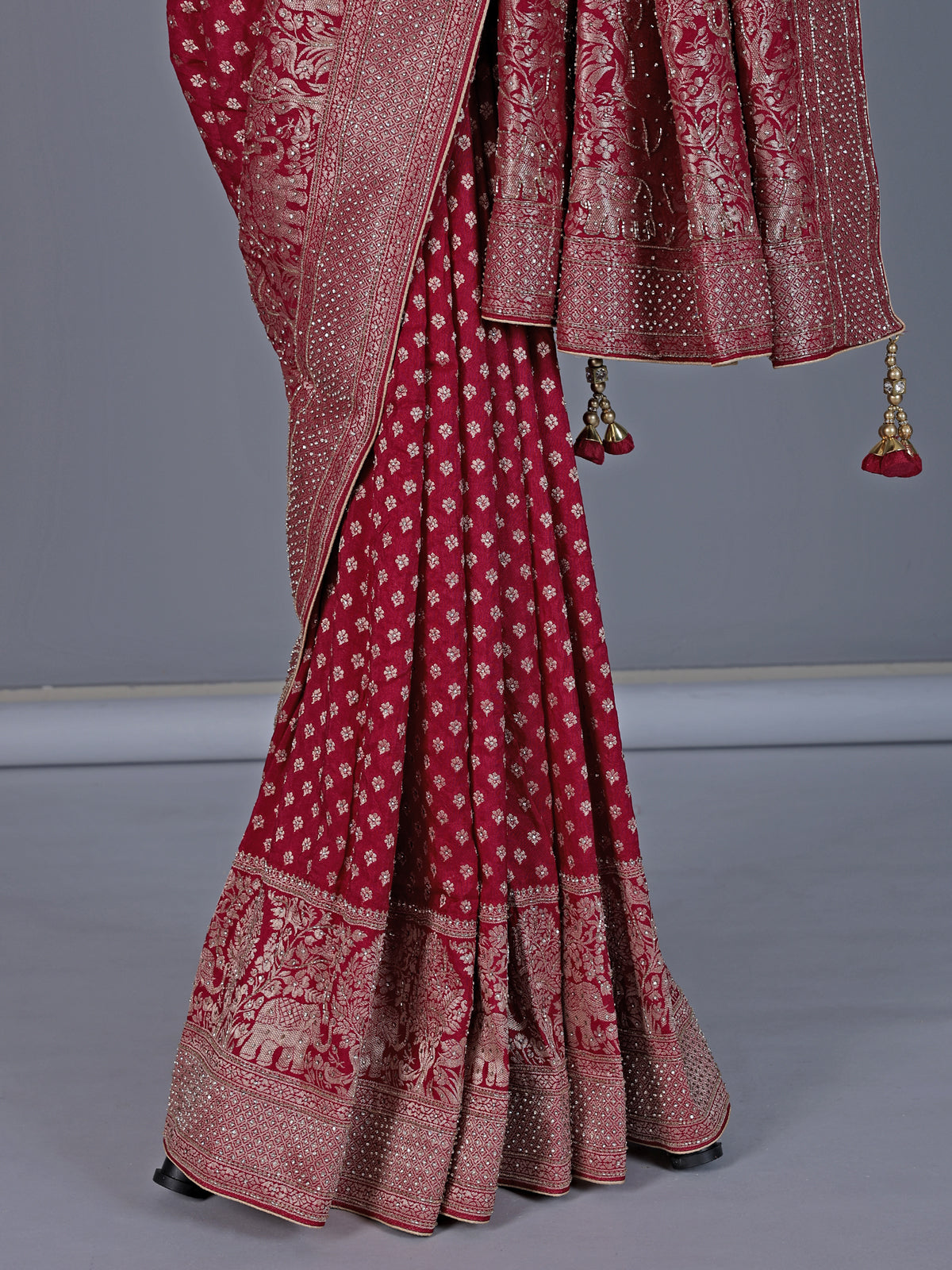 Maroon dola silk saree with elephant motif zari design