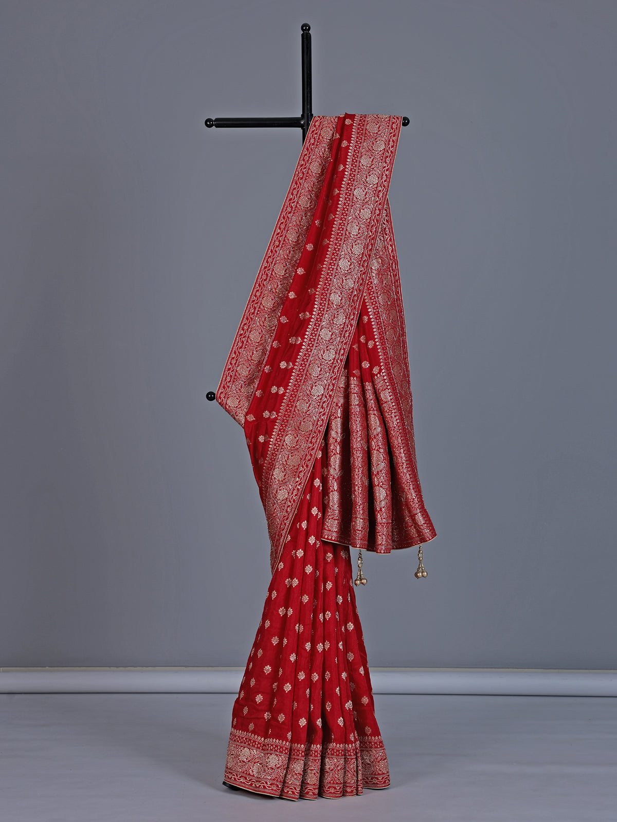 Red dola silk saree with stone zari butti work