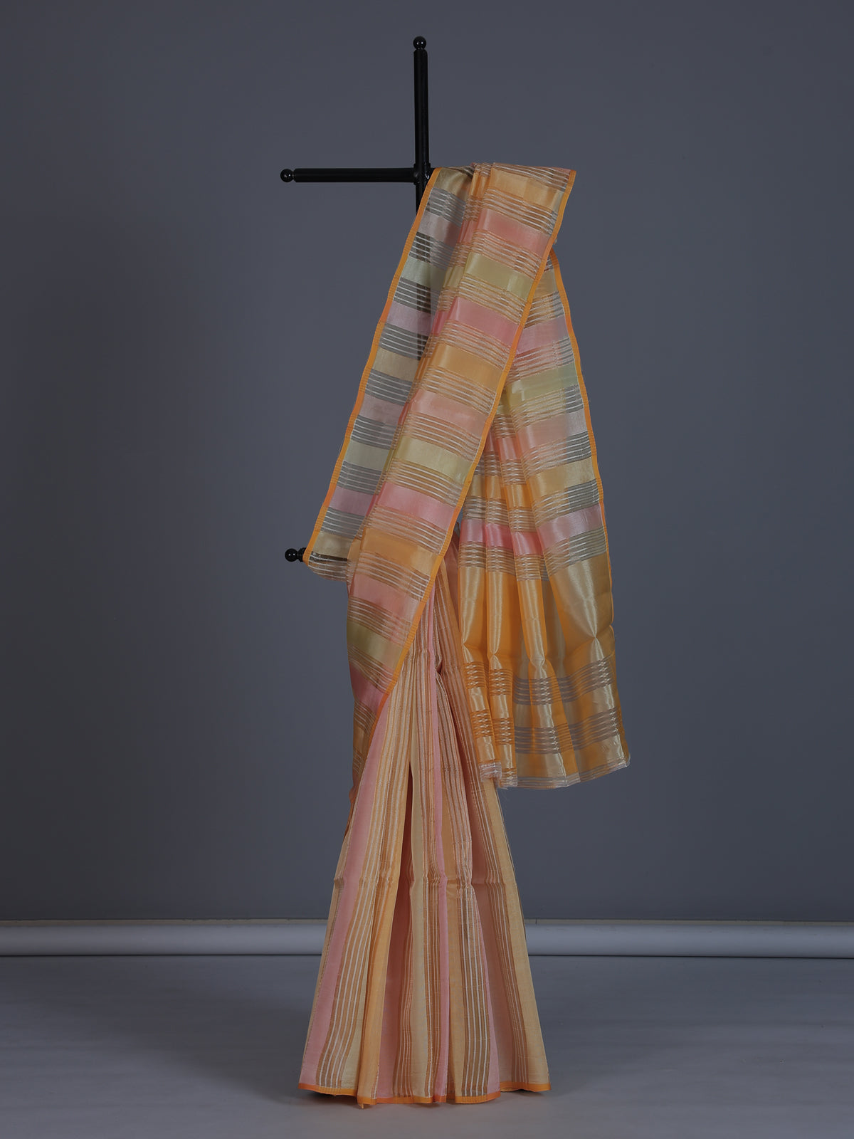 Peach striped organza saree for elegant sangeet evenings