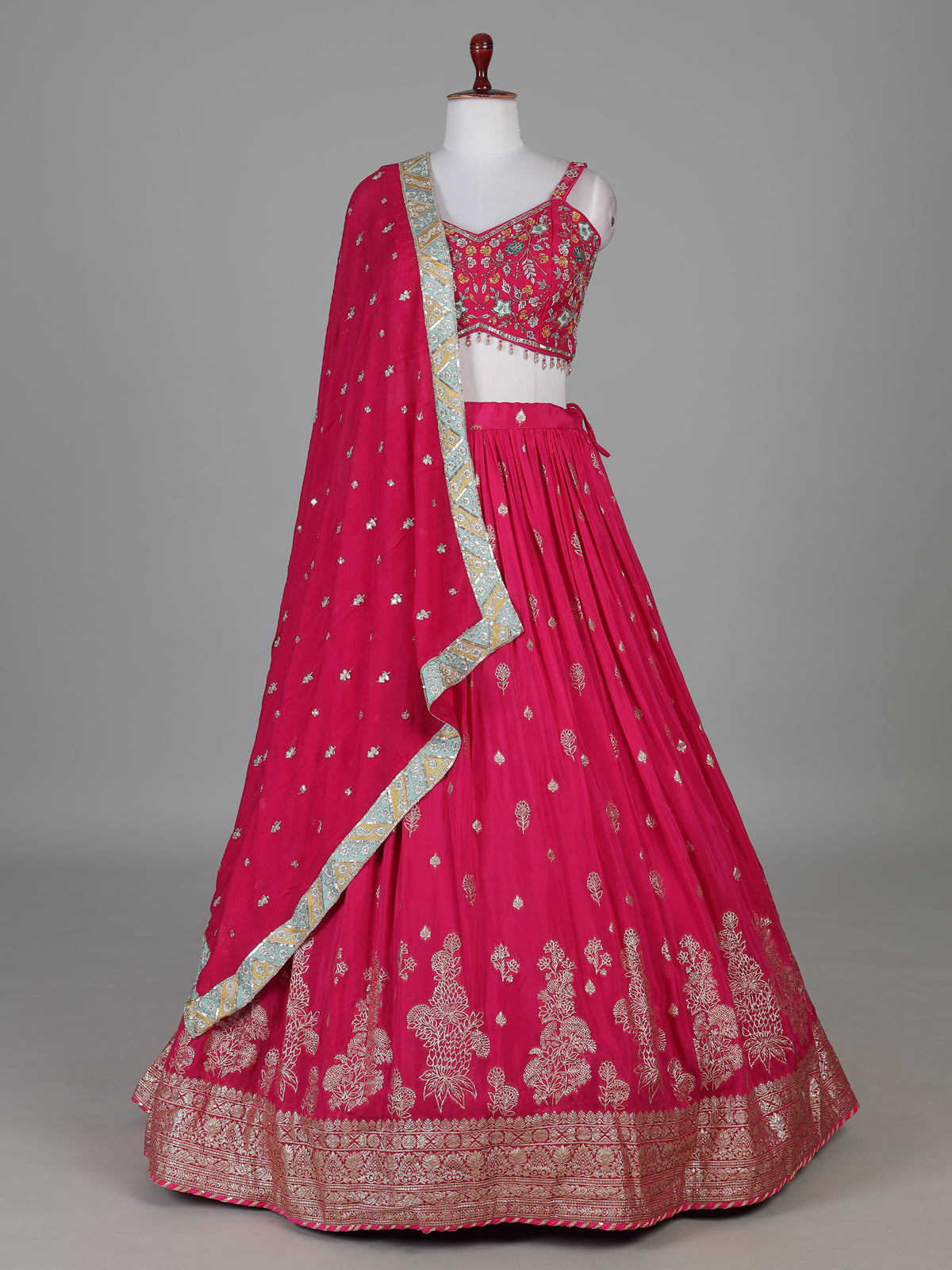 Rani pink silk lehenga choli with zardosi tassel detailing
