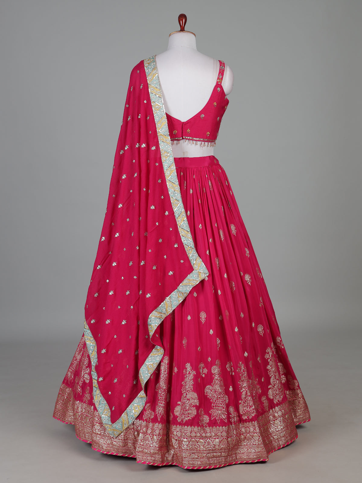 Rani pink silk lehenga choli with zardosi tassel detailing