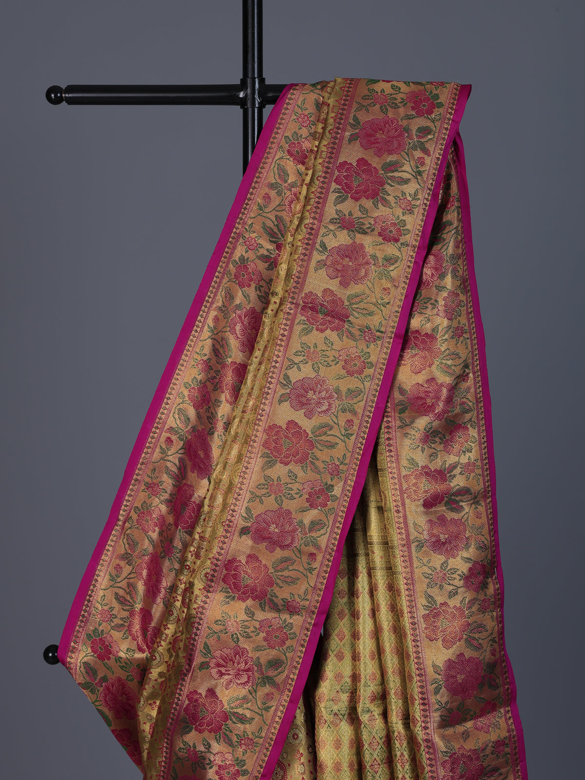 Golden Kanjivaram silk saree with floral motifs