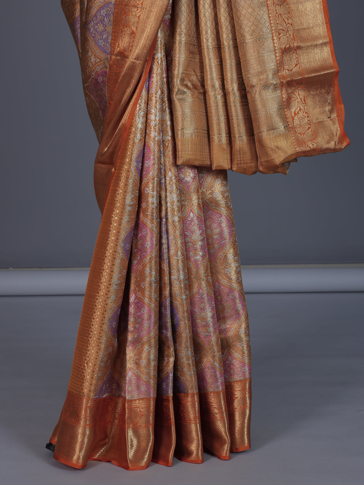 Golden Kanjivaram silk saree for weddings with ethnic motifs