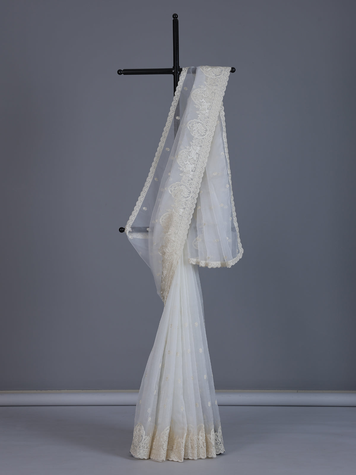 White organza tissue saree with graceful embroidered festive elegance