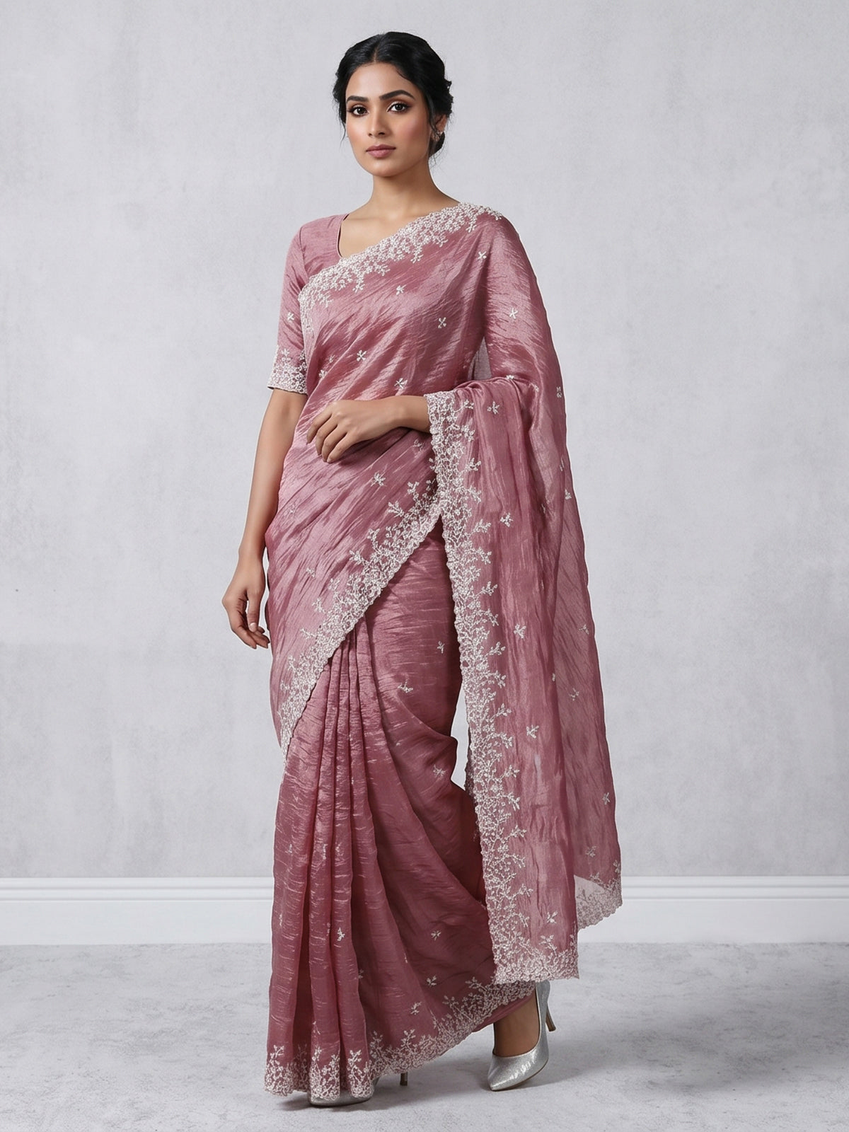 Onion pink tissue silk saree with shimmering festive elegance