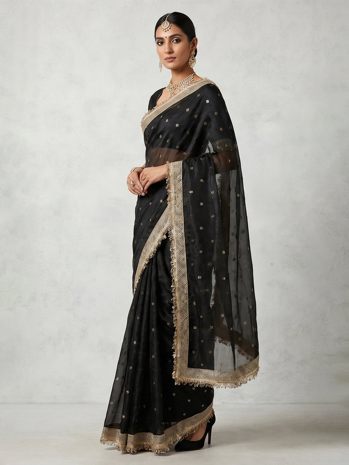 Black embellished semi soft tissue reception saree