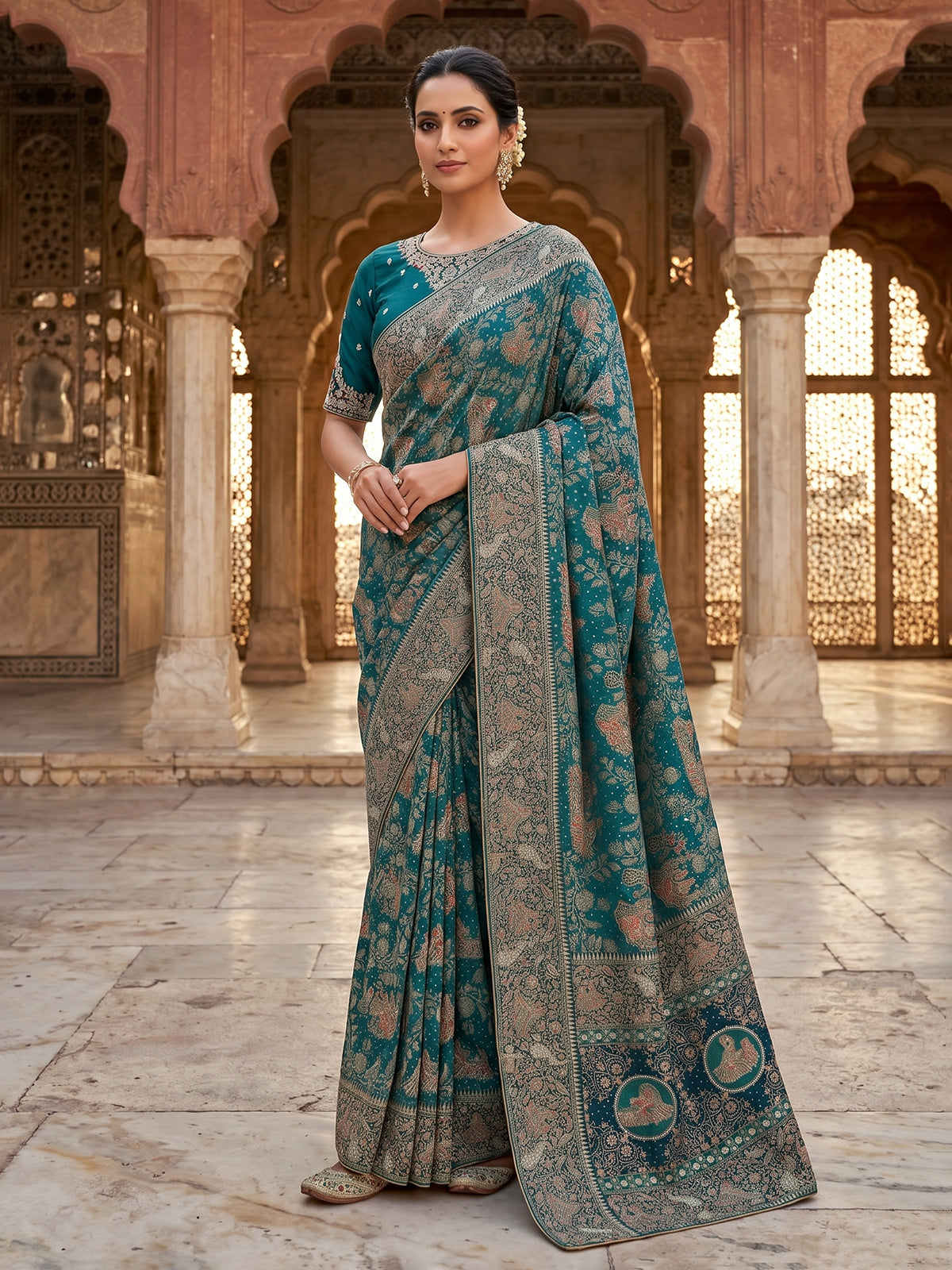 Teal green dola silk saree with royal motifs