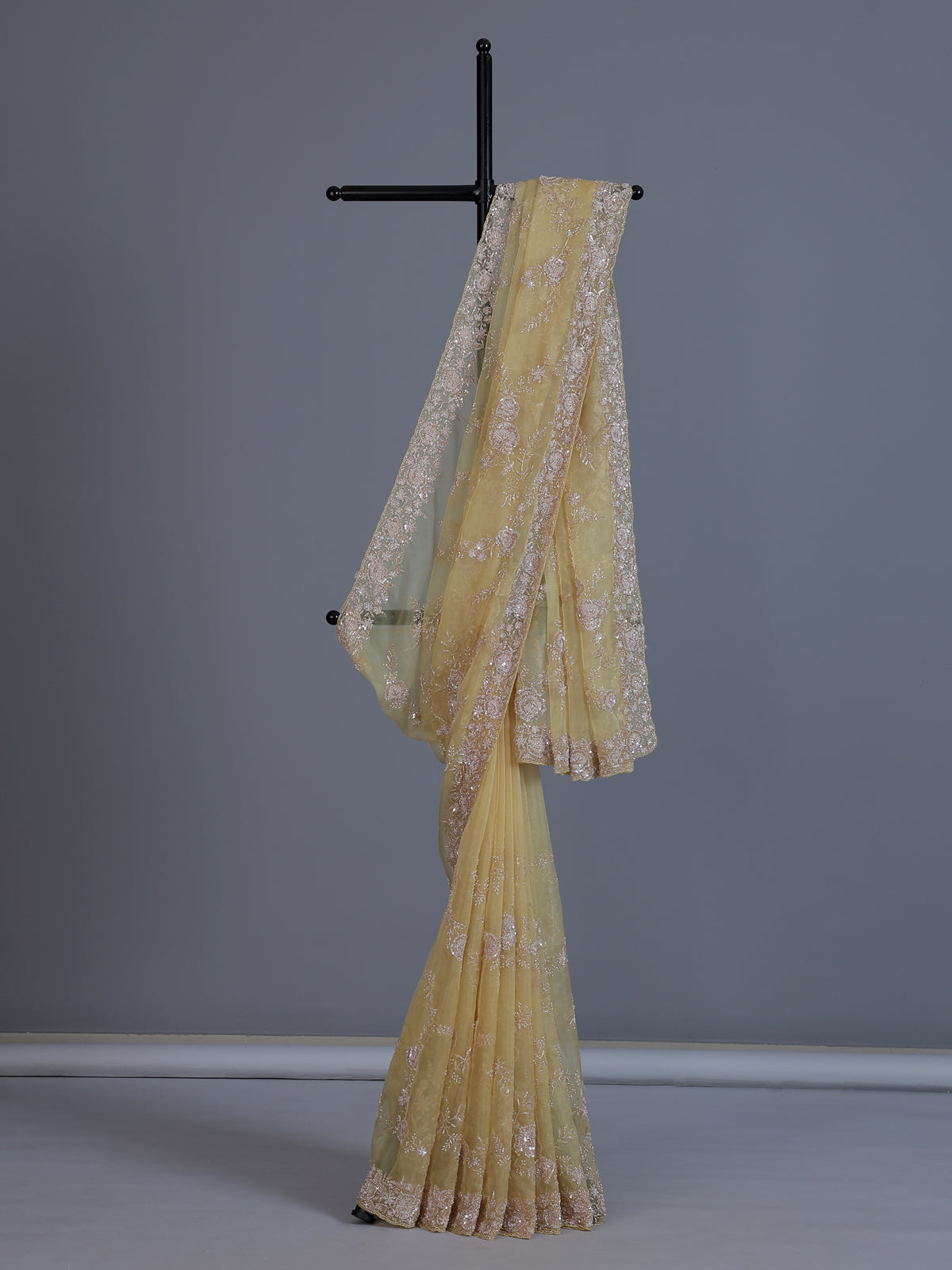 Yellow tissue silk saree with sequins and cutdana work