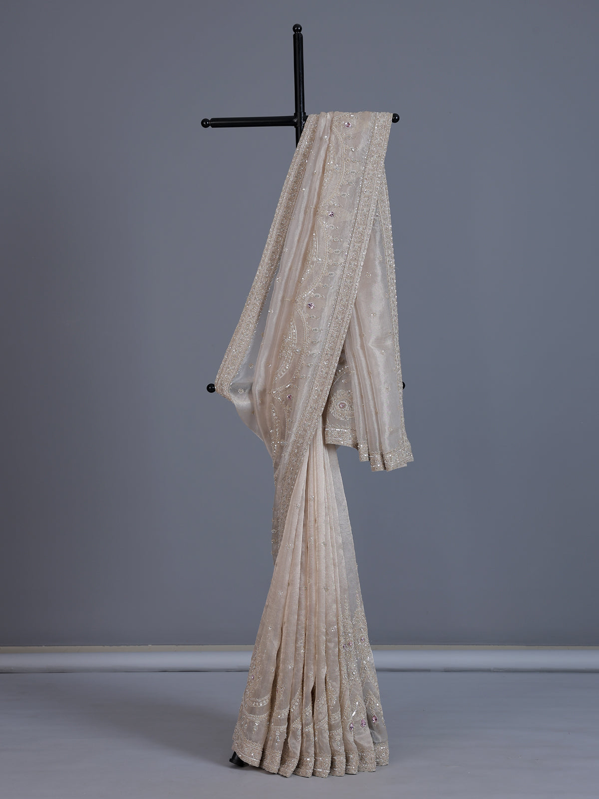 Beige tissue silk reception wear saree with cutdana work