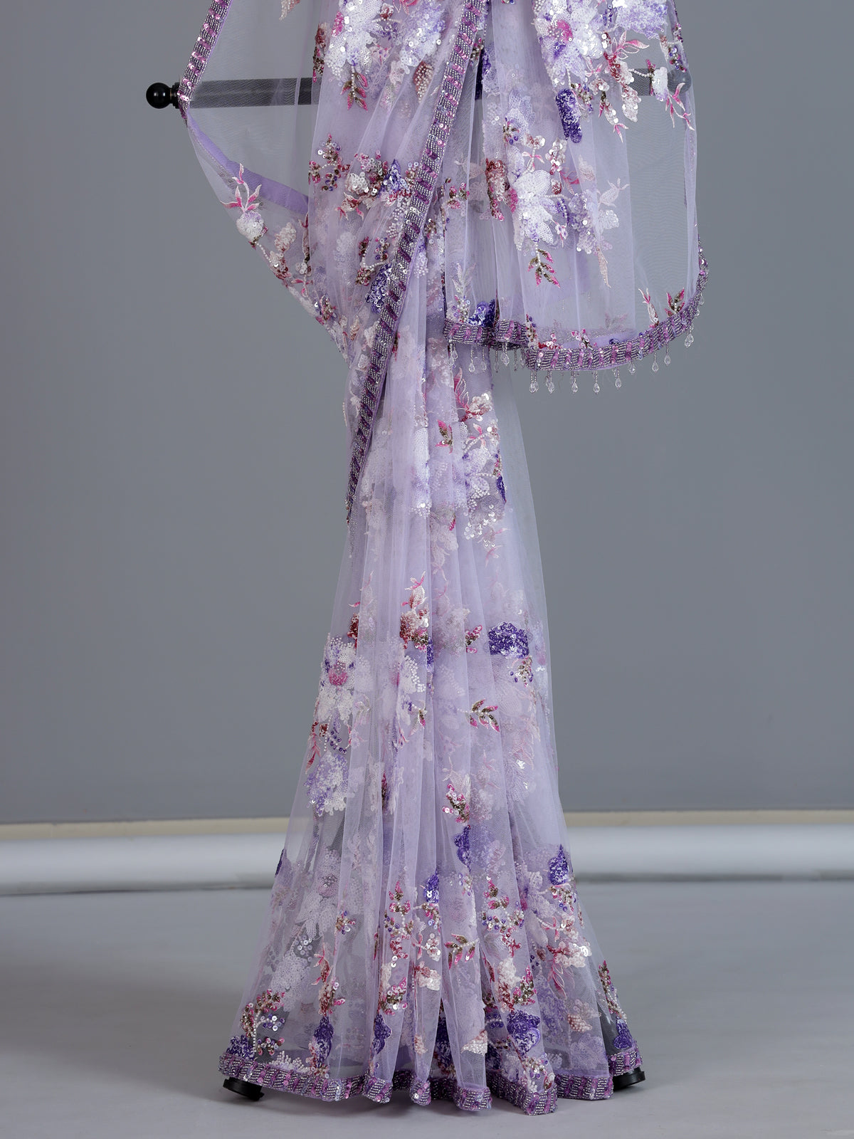 Purple reception wear net saree with heavy detailing