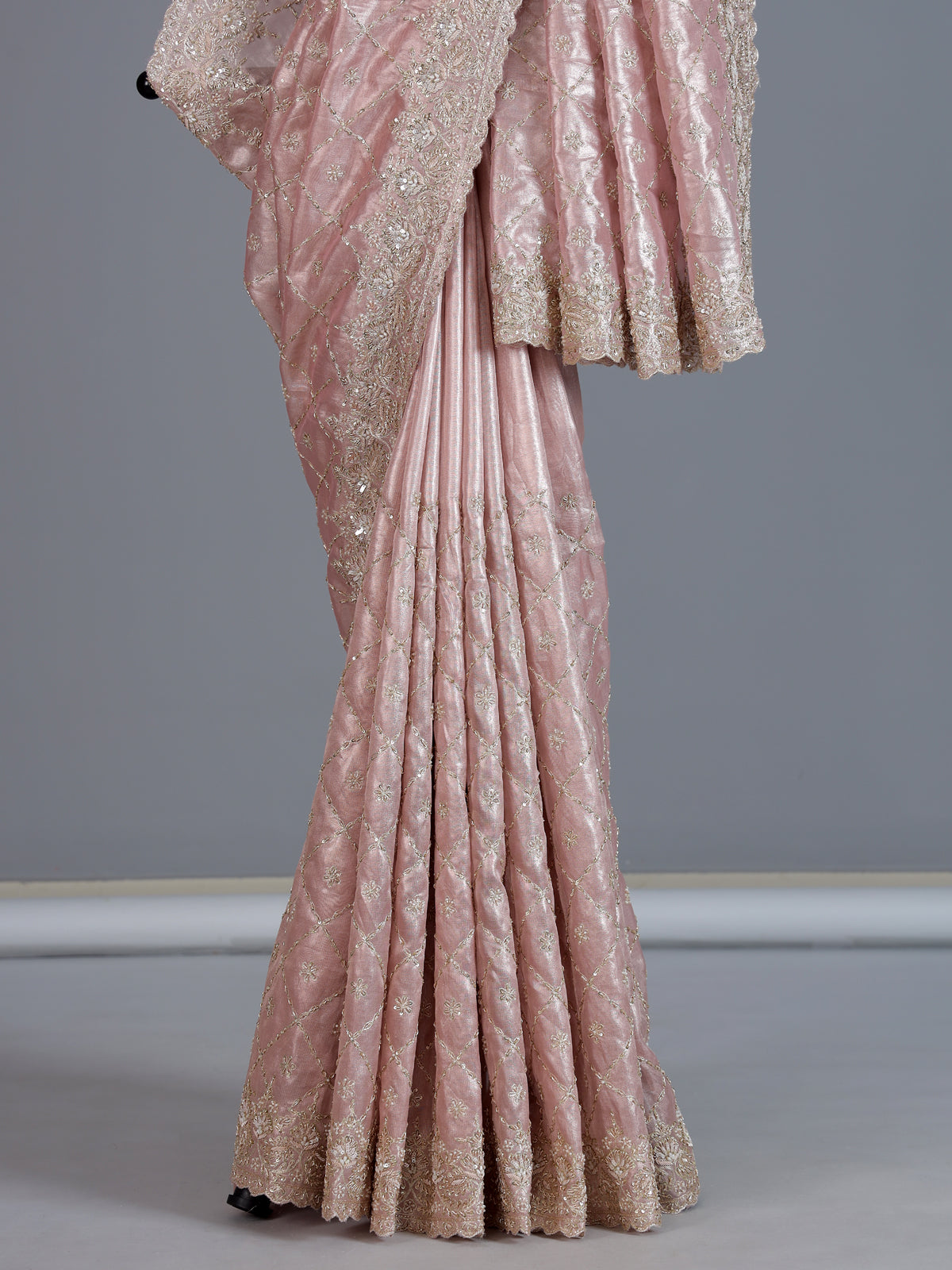 Peach tissue silk saree for wedding celebration