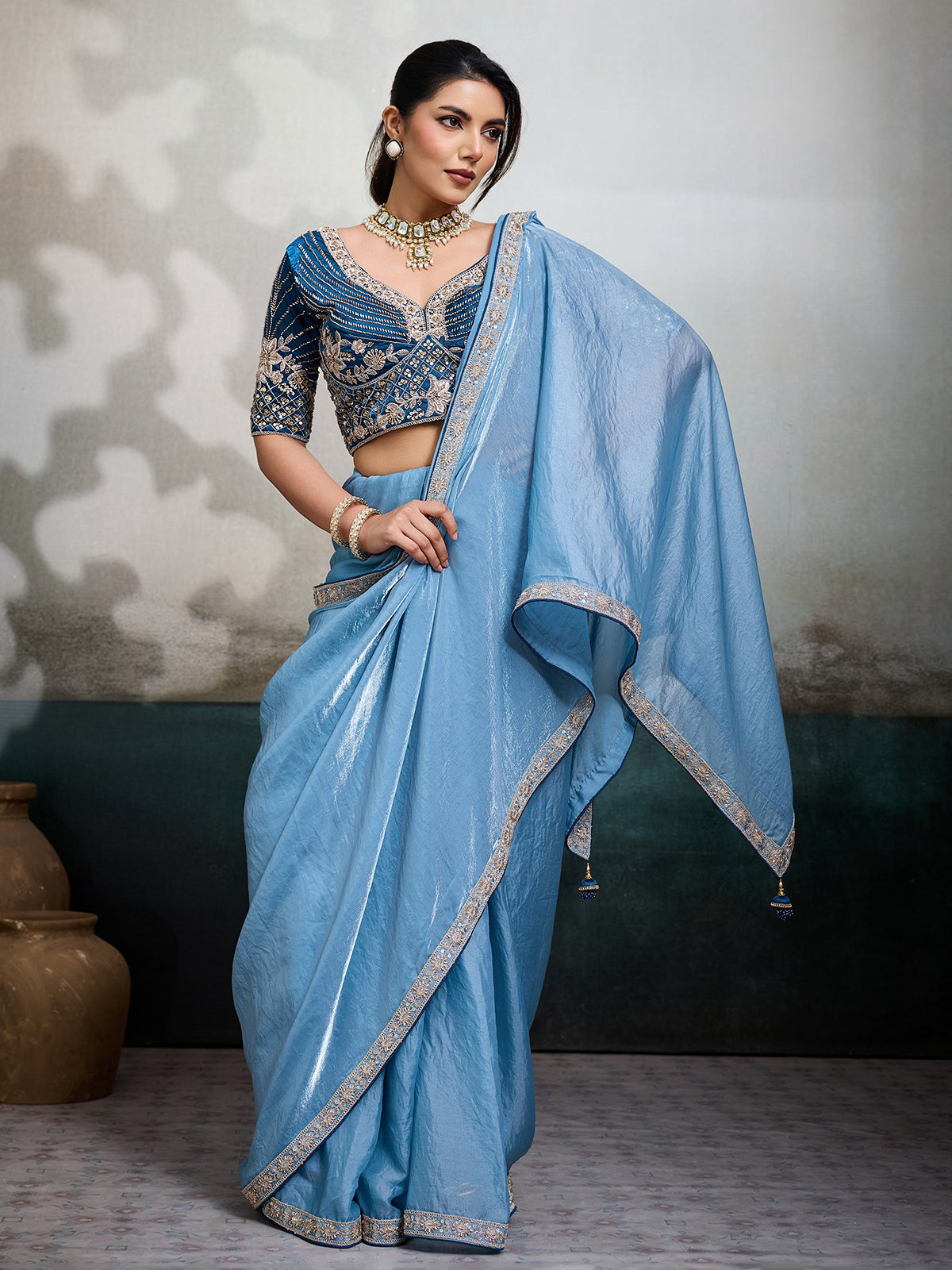 Sky blue satin saree with embroidered border