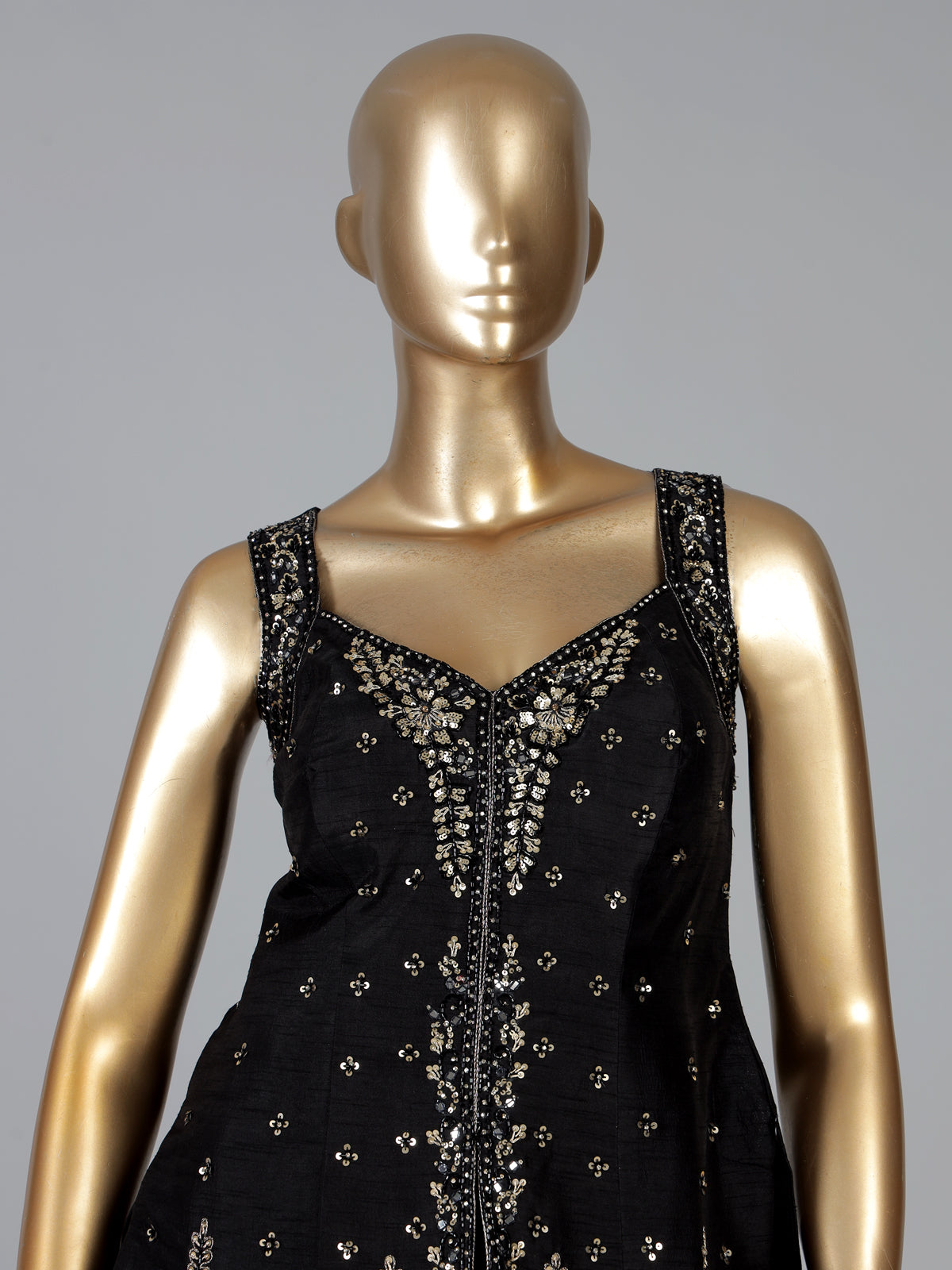 Black silk palazzo suit with elegant embellishments