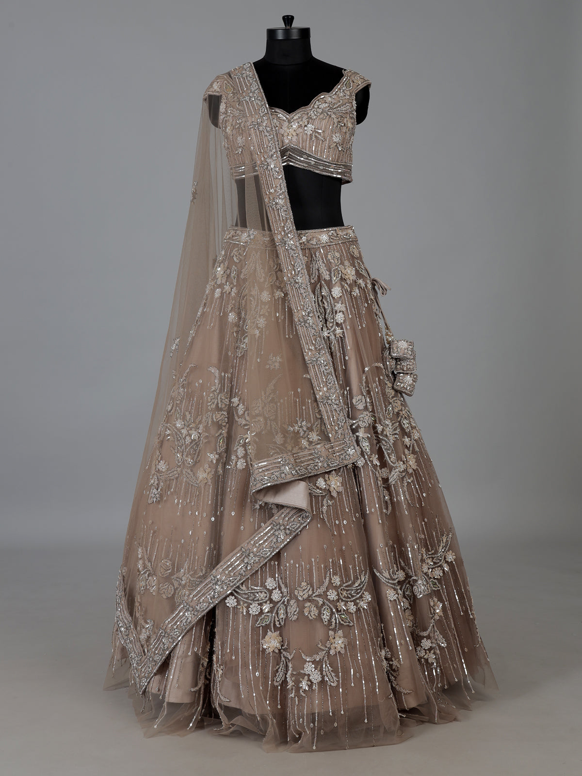 Beige net embellished lehenga choli for wedding functions