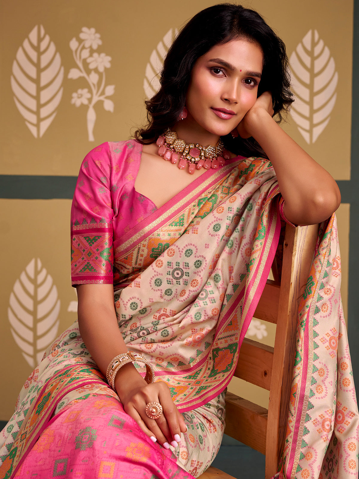 Heritage off white bandhani patola silk saree with contrast pink blouse
