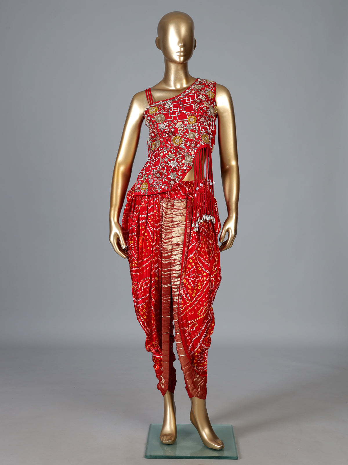 Red bandhej printed silk dhoti suit with embellishments